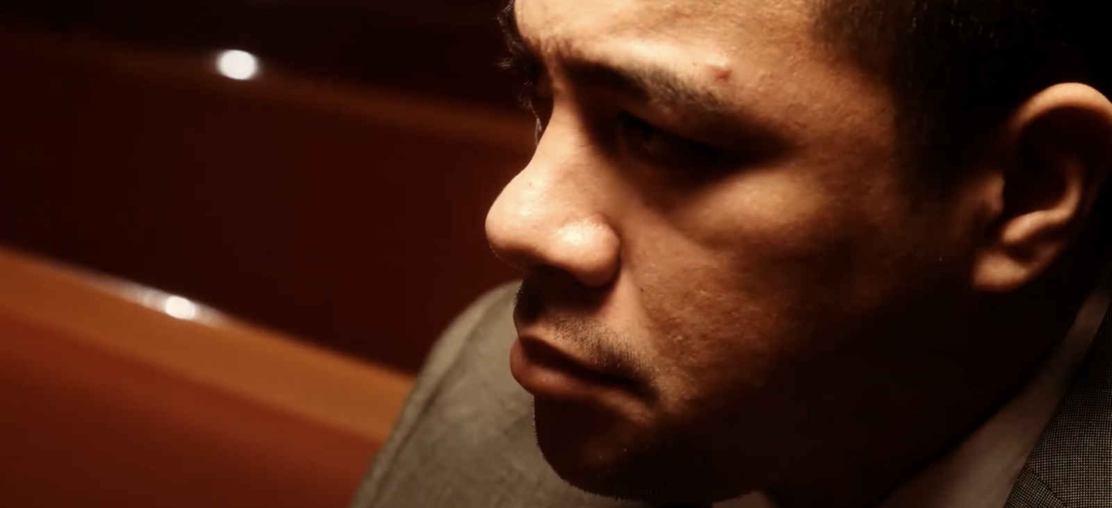 Close-up of a man's face in warm low light